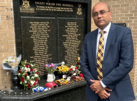 Prof Ajay Mahajan, the director of research at the plastic surgery and burns research unit, next to the memorial at Valley Parade.