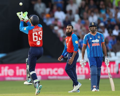 Jos Buttler of England takes the catch to dismiss Arshdeep Singh of India.