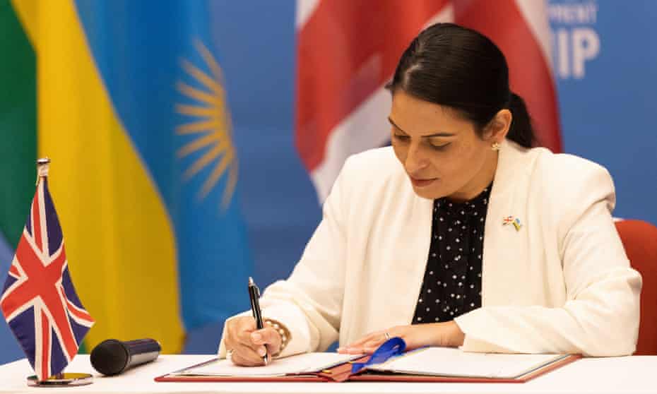 Priti Patel signing a migration and economic development partnership deal between the UK and Rwanda in Kigali.