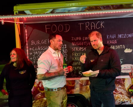 Prince Harry stops for a bite to eat at a road-side food truck.