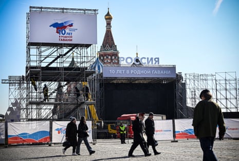 Workers building a stage for a concert in Moscow’s Red Square marking the 10th anniversary of Russia’s annexation of Crimea.