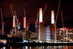 Two of Battersea Power Station’s chimneys are lit up for the first time since they were rebuilt, November 2017. Carillion is working on the redevelopment.