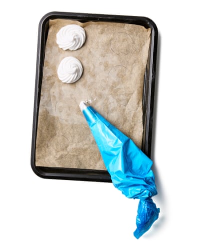 Felicity Cloake’s vegan meringues 05a. Transfer to the piping bag, if using, and pipe or spoon roughly 5cm rounds on to the lined trays and slightly spaced out (or make shapes of your choice). Bake for about two hours, by which point the meringues should be completely dry and lift easily off the sheets.