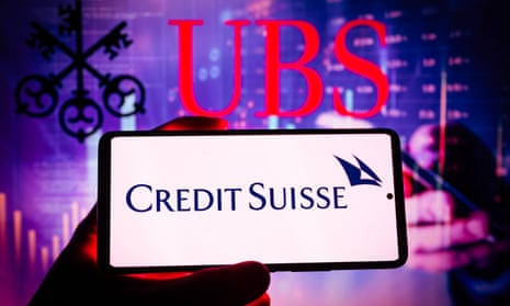 Credit Suisse logo displayed on mobile with UBS seen in the background.