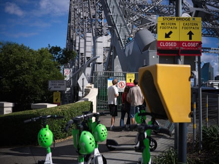 Pedestrians arriving at the bridge find signs saying it is closed