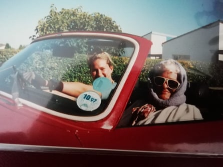 Jasmine and her grandma smile for the camera from the Triumph Spitfire