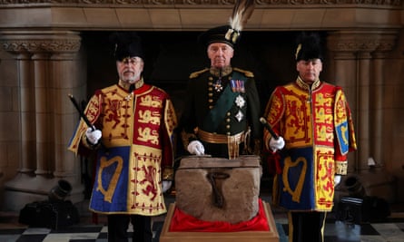 Officials stand by the Stone of Destiny at Edinburgh Castle on Friday.
