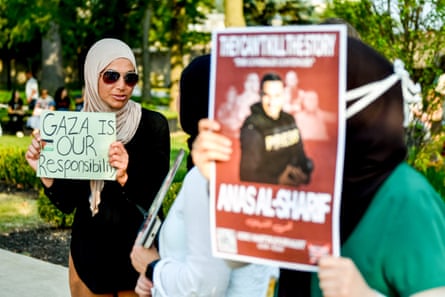 a person holds a sign that reads ‘Gaza is our responsibility’