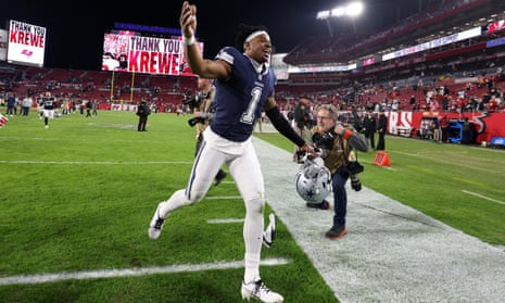 Cowboys maul Brady's listless Bucs for first road playoff win in