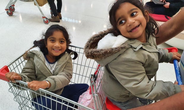 Tharnicaa and Kopika at a supermarket after being reunited in Perth