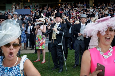 Racegoers watch the finish of the third race in the Royal Enclosure during day two of the Royal Ascot meeting 2017
