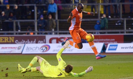 Sanmi Odelusi goes clear of Carlisle United goalkeeper Mark Gillespie to score Blackpool’s third goal.