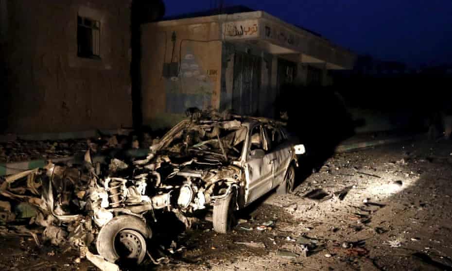 Car wreckage at site of car bomb attack