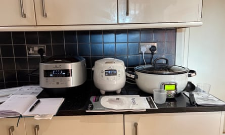 Three rice cookers on a kitchen worktop