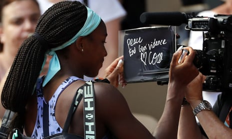 Coco Gauff writes “Peace. End gun violence” on the camera after winning against Martina Trevisan
