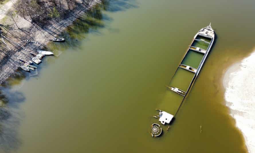 A photo taken by Alessio Bonin using a camera attached to a drone of a sunken cargo boat that has re-emerged from the Po.