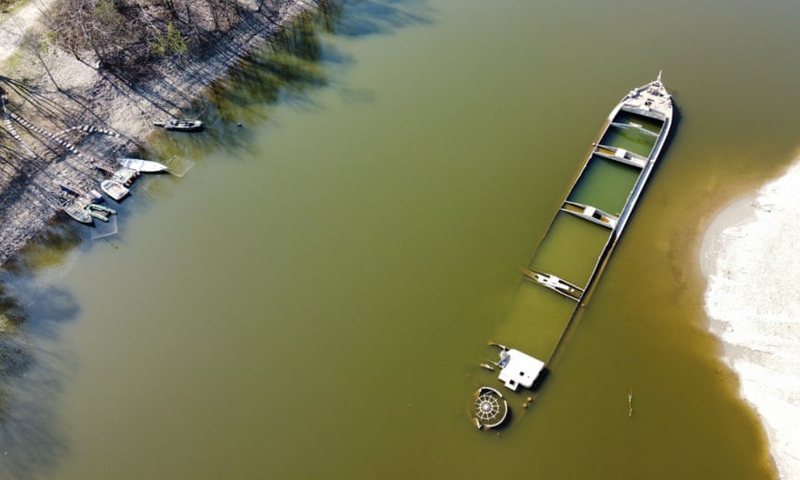 A photo taken by Alessio Bonin using a camera attached to a drone of a sunken cargo boat that has re-emerged from the Po.