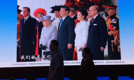 Xi pictured with the Queen in London. One expert believes the president wants to stay in power ‘forever’.