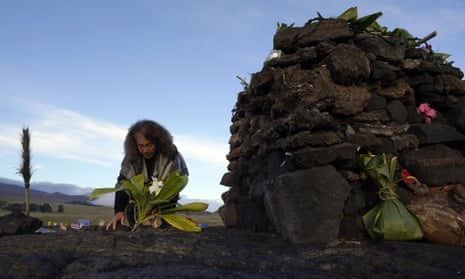 Illona Ilae, a Native Hawaiian from Kailua-Kona, leaves an offering at an altar below the Mauna Loa.