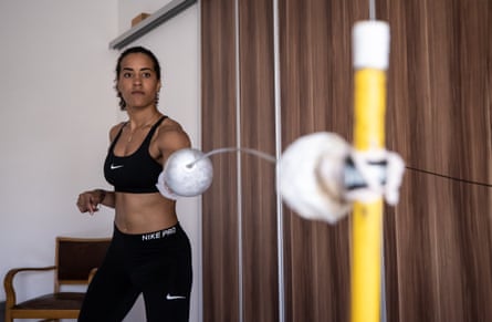 A woman with a fencing foil.