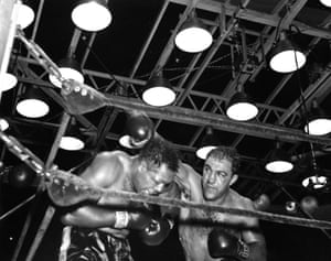 Rocky Marciano, right, throws a right hook against Archie Moore during their fight at Yankee Stadium in New York. Marciano won the World Heavyweight Title by a KO in the ninth.