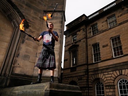 Super Scott practising his fire-juggling routine outside St Giles’ Cathedral.