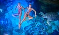 Great Britain’s Kate Shortman (right) and Izzy Thorpe swim with turtles at the London Aquarium.