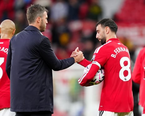 Manchester United head coach Michael Carrick and captain Bruno Fernandes shake hands earlier in the season.
