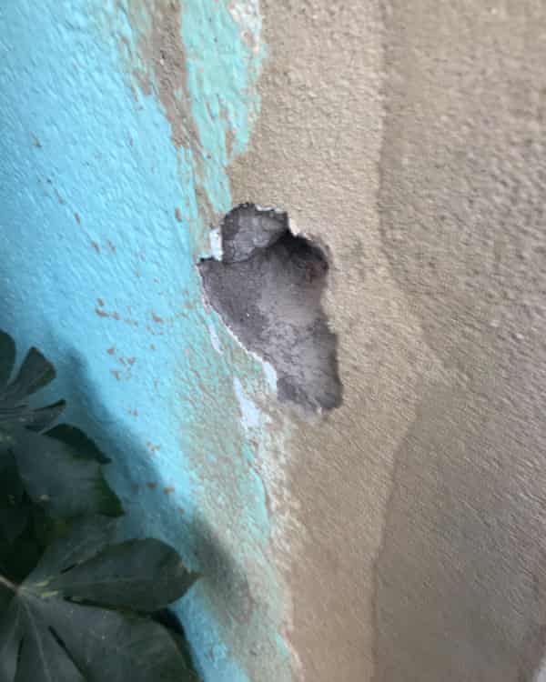 A bullet hole in a wall after a helicopter fired shots in Maré.