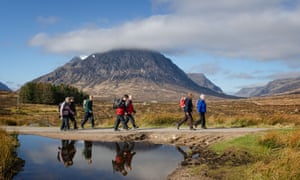 Walkers on the West Highland Way crossing Rannoch Mor close to the head of Glen Coe.