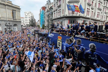 Oviedo’s players celebrate with supporters