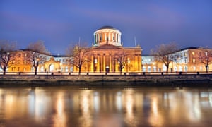 A view of the river Liffey and the four courts at dusk.