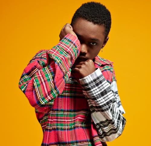 Ashton Sanders, star of Moonlight film, against a yellow background