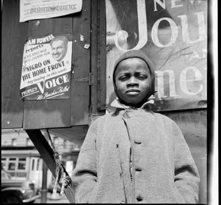 a boy looking at a camera