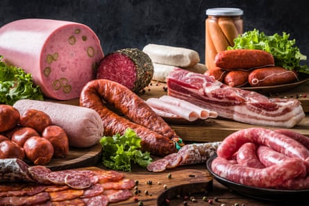 Various sausages on a rustic wooden table