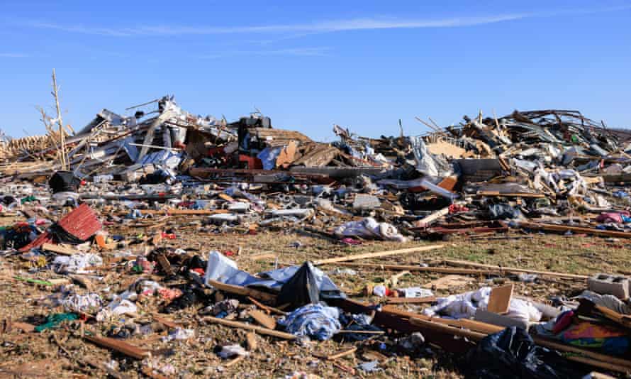 Debris are piled after a tornado tore through rural Kentucky