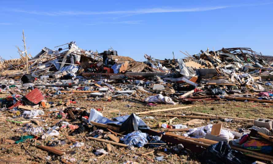 Kentucky tornadoes: hopes rise that candle factory death toll could be lower than feared | Kentucky 3 Debris are piled after a tornado tore through rural Kentucky