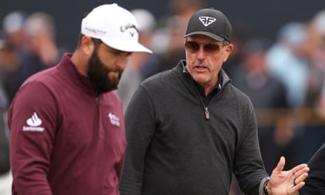 Jon Rahm and Phil Mickelson chat on the course