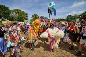 Performers and revellers take part in dressed flamboyantly