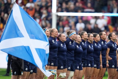 Scotland's players sing their national anthem.