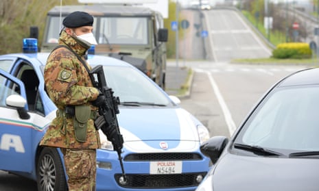 Italian soldiers and law enforcement officers carry out controls in Sesto San Giovanni, near Milan