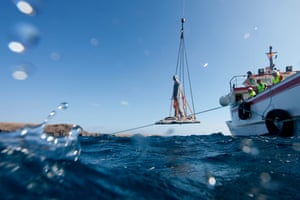 One of the sculptures being lowered into the Atlantic