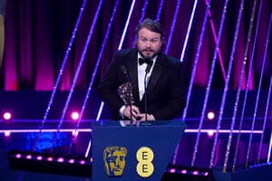 Brady Corbet accepts the director award for The Brutalist