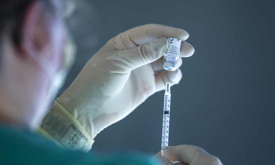 A medic prepares a dose of Pfizer/BioNTech vaccine