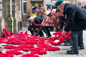People lay wreaths during the Remembrance Sunday service at the Stone of Remembrance in Edinburgh