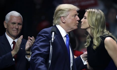 Donald Trump kisses his daughter Ivanka Trump during a rally in Manchester, New Hampshire in November 2016.