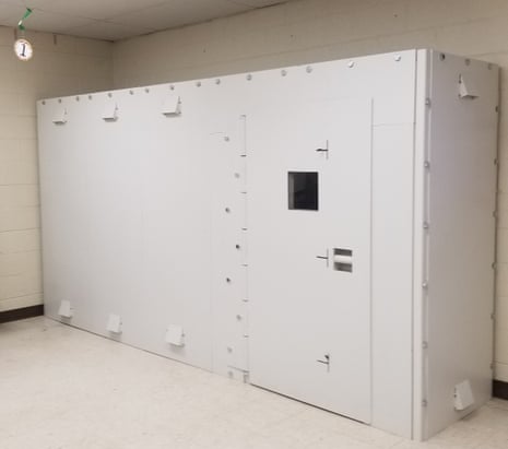 white metal box the shape of a school locker