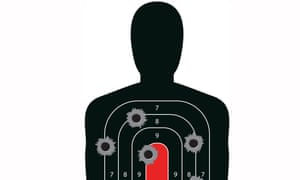 Indoor shooting range silhouette paper target shot full of bullet holes