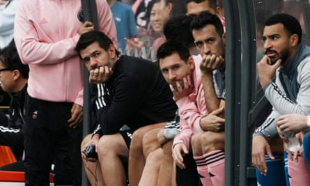 Inter Miami’s Lionel Messi sits on the bench during Sunday’s match in Hong Kong.
