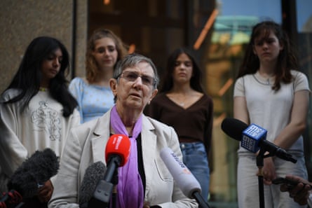 Litigation Guardian Sister Brigid Arthur, with high school students Anjali Sharma, 17, Ava Princi, 18, Izzy Raj-Seppings, 15, and Luca Saunders, 16, outside the NSW Federal Court in Sydney.